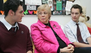 Grandmother Talking With Teenager Sons