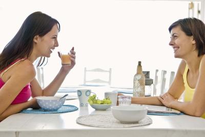 Mom and Daughter on Breakfast Table